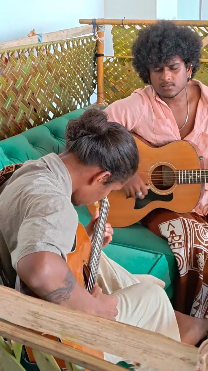 Two guitarists playing together