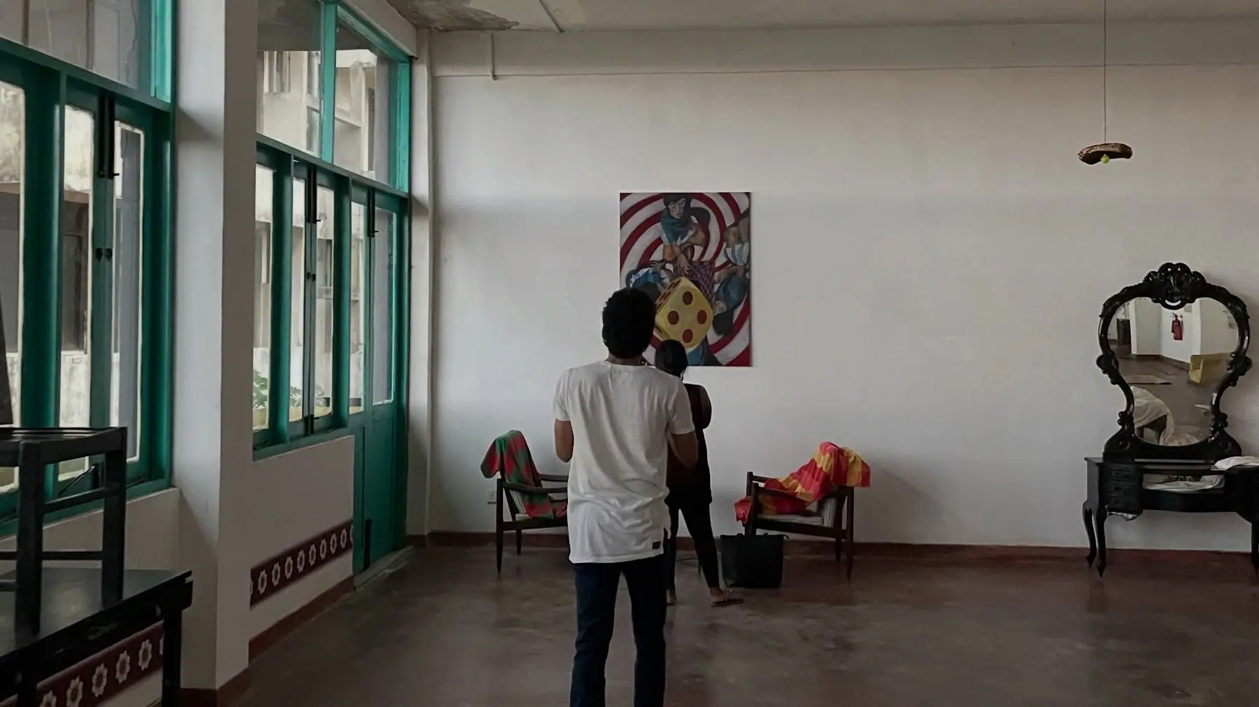 The gallery on a sunny afternoon, paintings on white walls