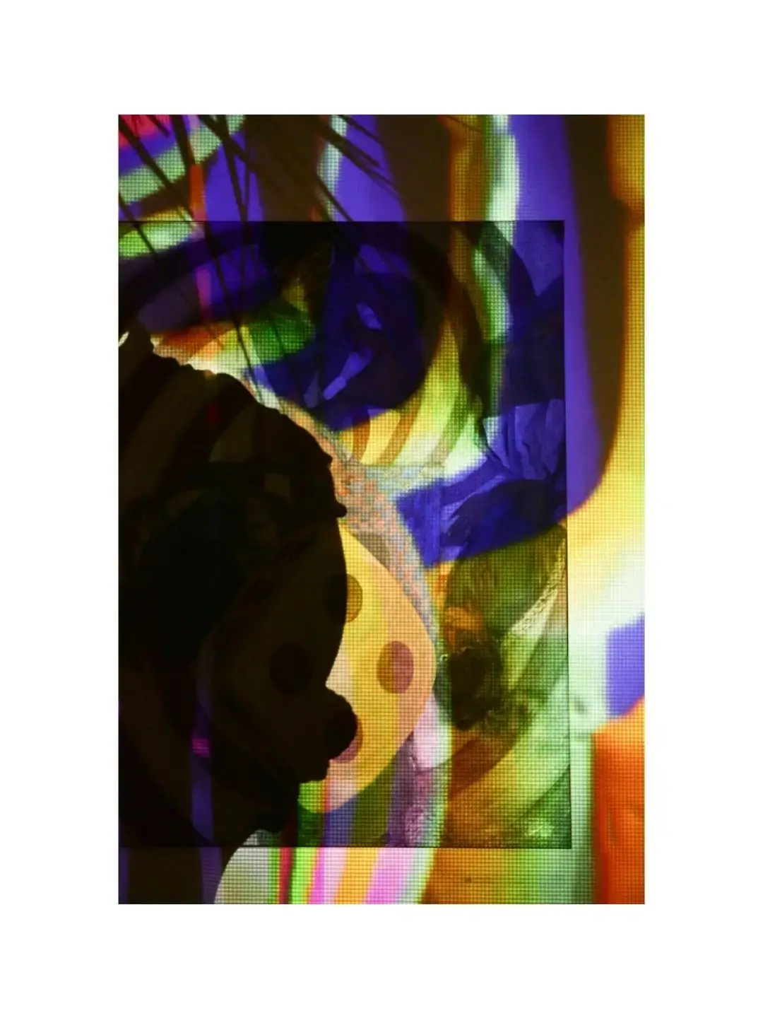 A silhouette in coloured projected light